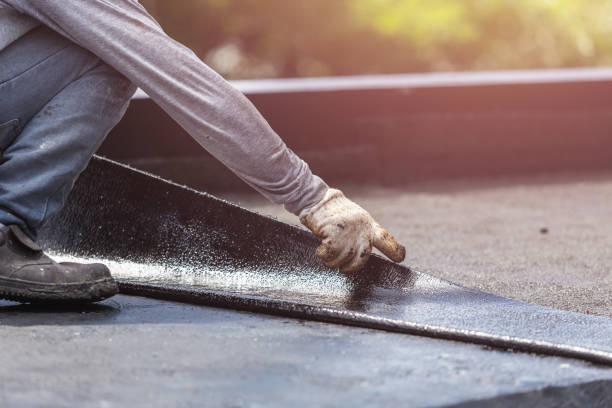 Professional Basement Waterproofing technician working in Smithfield, KY
